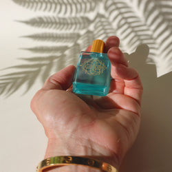 Hand holding the Egyptian Blue Lotus perfume oil
